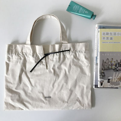 폴리에스터 배열 재료 사용자 지정 로고 인쇄 된 린 솜 캔버스 드래그 스트링 토트 가방