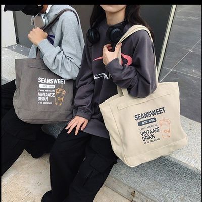 주머니 가 있는 중형 토트 핸드백