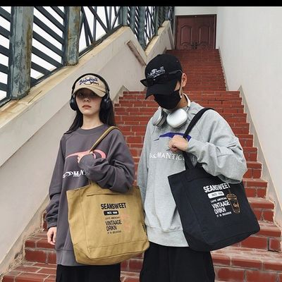 주머니 가 있는 중형 토트 핸드백